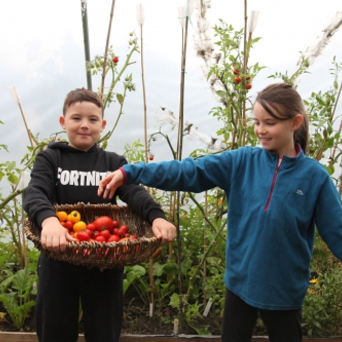 boy and girl hold food