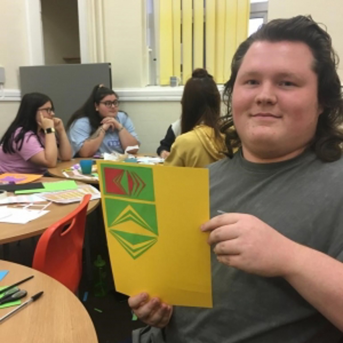 boy holding a card