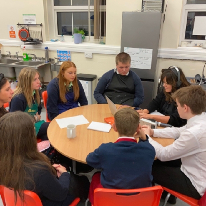 people talking around a table