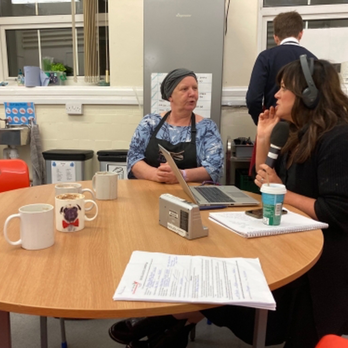 people talking to each other over a table 